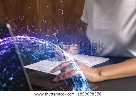 Businesswoman typing on laptop in office. Abstract technology hologram. Double exposure.