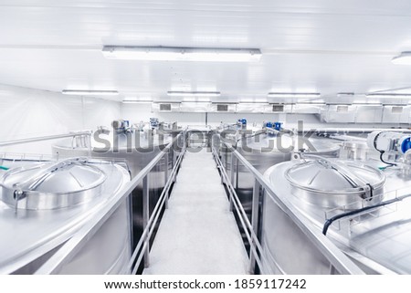 Equipment dairy plant, milk factory industry. Stainless steel storage and processing tanks.