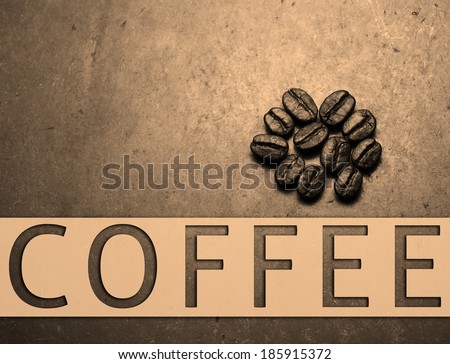 Roasted Coffee beans on texture concrete board, vintage retro background