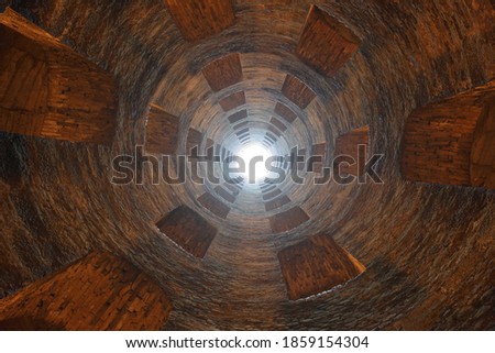 Light at the end of the tunnel. View from teh bottom of  "St. Patrick's Well", Orvieto, Italy.