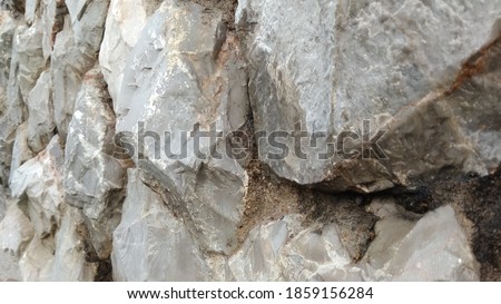 Wall shot, made of stone, close-up, center-focus, rough texture, hard feeling, cool moment, suitable for background images, abstract.

