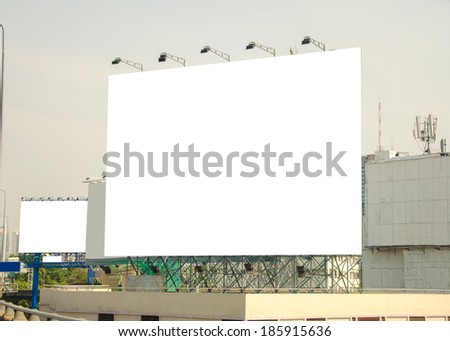 large blank billboard with city view background.
