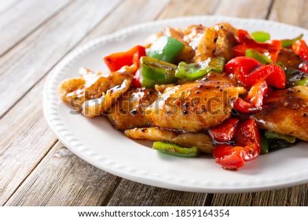 A view of a plate of sweet and sour poached white fish.