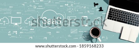 SaaS - software as a service concept with a laptop computer on a desk