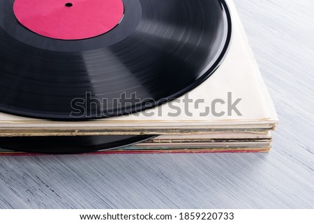 stack of old vinyl records, top view, close-up