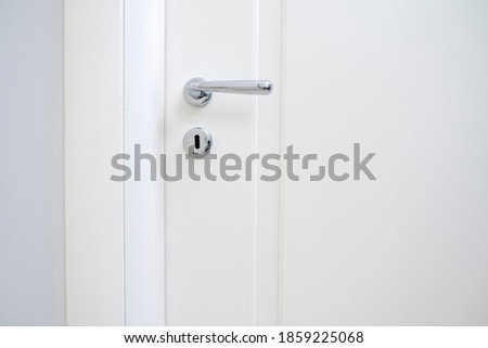 metal handle of modern new room white door Royalty-Free Stock Photo #1859225068