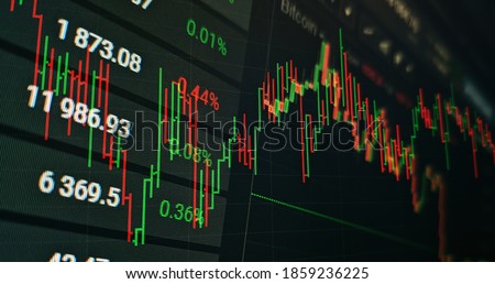 Technical price graph and indicator, red and green candlestick chart on blue theme screen, market volatility, up and down trend. Stock trading, crypto currency background. Royalty-Free Stock Photo #1859236225