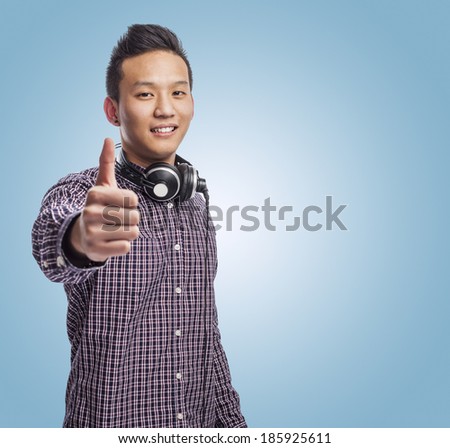 portrait of young asian man smiling with headphones