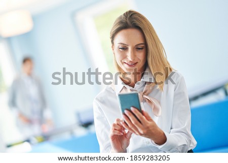 Adult businesswoman using computer in playroom relax zone