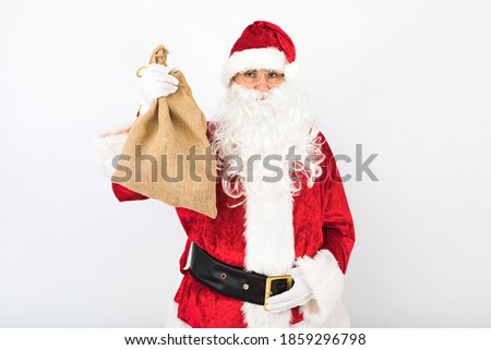 Santa Claus holding sack white background. Christmas concept