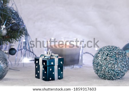Blue gift card background, soft focus, Christmas decoration, Hanukkah, dots on gift box, balls, fairy lights, pine tree, burning candle, cozy, hygge home decoration