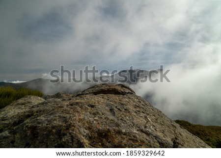 mountain covered by white clouds