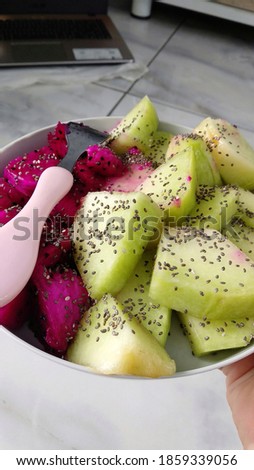 Melon and dragon fruit with chia seeds for breakfast