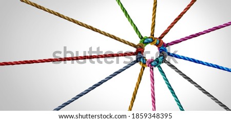 Working team unity and teamwork concept as a business metaphor for joining a partnership as diverse ropes connected together as a corporate symbol for cooperation and worker collaboration. Royalty-Free Stock Photo #1859348395
