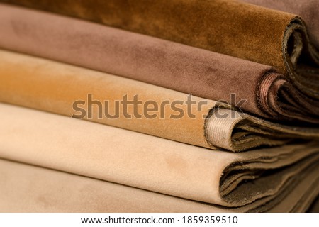 Light Set Sail Champagne and grey colors velour textile samples. Fabric texture background