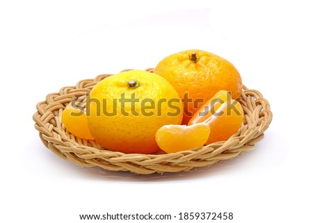 Orange : Chinese orange in wooden basket isolated on white background. Seedless oranges, Mandarin oranges.