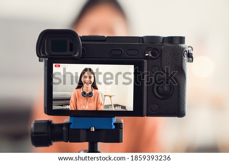 Young beautiful Asian woman influence vlogger talking on live streaming online broadcast.