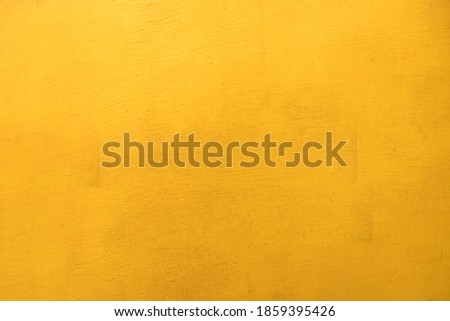 Gold paint on cement wall texture background