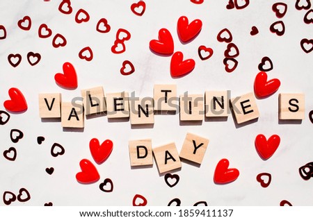 Banner.The word "Valentine's Day". Love on wooden blocks. Theme of love. Wooden letter blocks. Loving, positive emotions. Wooden cubes with the word. An exclusive relationship.