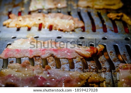 Closeup of Japanese yakiniku being cooked on grill