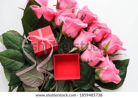 large bouquet of pink roses and empty open gift box Royalty-Free Stock Photo #1859485738