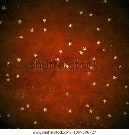 Christmas confetti, golden glitter texture on a dark background.