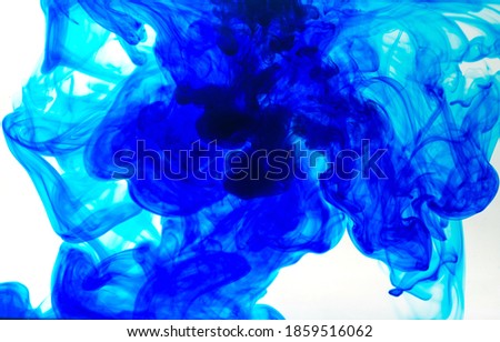 color ink in water isolated on white, Paint drops in water, movement of colored drops, Abstract background.