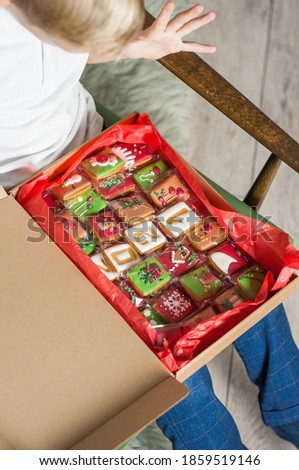 Open Christmas gift box with set of gingerbreads