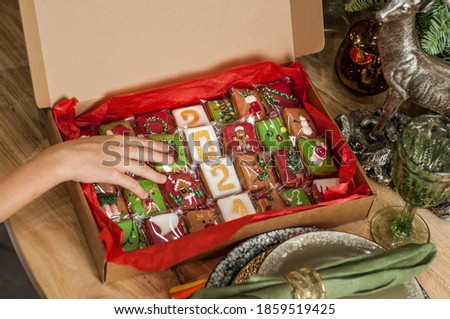 Open Christmas gift box with set of gingerbreads