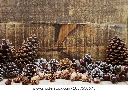 Christmas Festive background concept decoration with Christmas tree and pine cones on wooden background