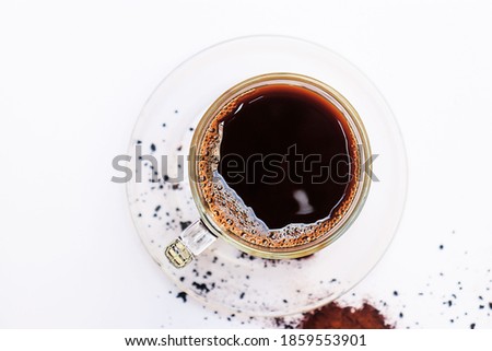 With a cup coffee on a white background