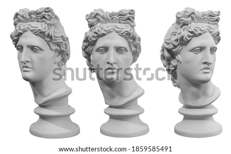 White gypsum copy of ancient statue of Apollo God of Sun head isolated on a white background. Plaster sculpture of man face. Renaissance portrait Royalty-Free Stock Photo #1859585491
