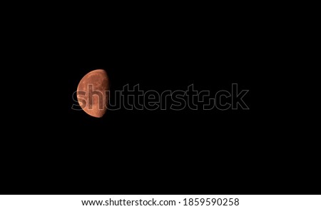 Red Moon Rising to The Sky Royalty-Free Stock Photo #1859590258