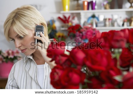 Female florist on cell phone