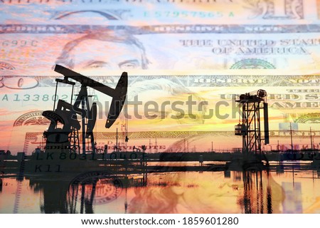 Petroleum, petrodollar and crude oil concept, Oil pump on background of US dollar, Dollars and oil pumps