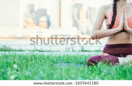 Beautiful girl making morning yoga training in New york