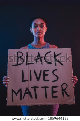 Beautiful girl protestingfor the social movement BLACK LIVES MATTER in usa