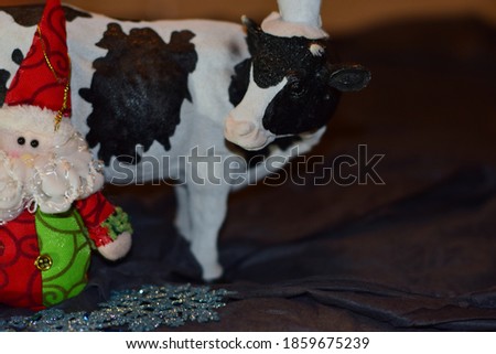 Santa Claus and the cow