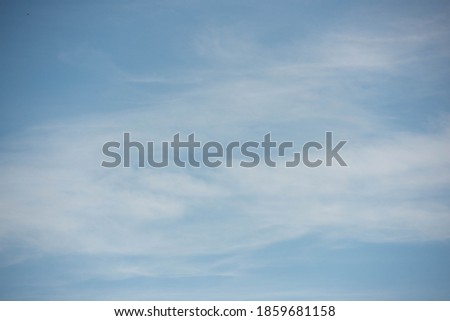 picture of a blue sky with soft clouds