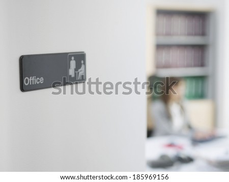 Office Sign, Office Worker in Background