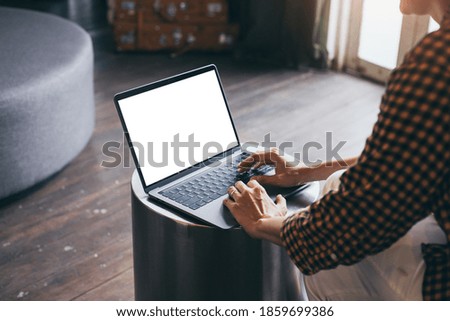 computer blank screen mockup.hand woman work using laptop with white background for advertising,contact business search information on desk at coffee shop.marketing and creative design