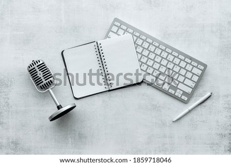 Microphone and keyboard on studio table, top view. Audio equipment and recording
