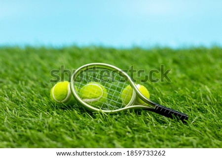 Tennis  ball and racket on white background