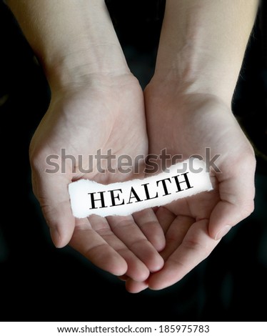 Person hands holding cupping paper message for Health