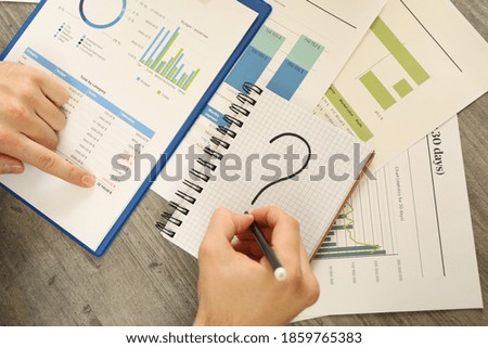 Concept of finance with man doing a financial planning