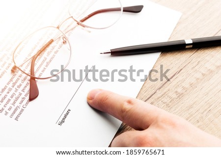 Businessman is signing a contract, business contract details.