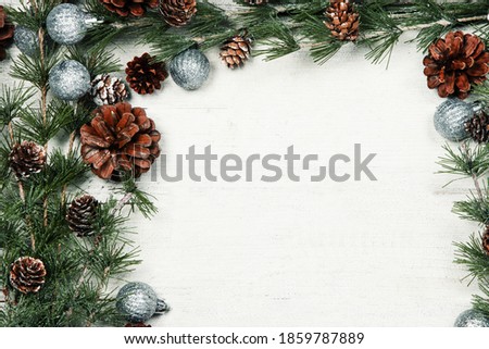 Happy New Year 2020 greeting card. Christmas branches on rustic wooden background. Space for text. Top view