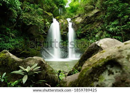 Jungle double waterfall cascade in tropical rainforest with rock, Sapan Waterfall beautiful waterfall of NAN province in north thailand