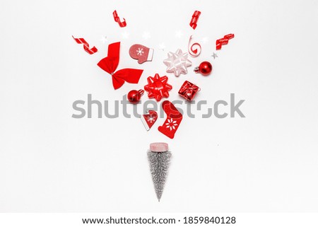 Xmas decoration. Stocking, gifts, winter tree, ribbon and bow in Christmas composition on white background for greeting card. Decoration and copy space for your text.
