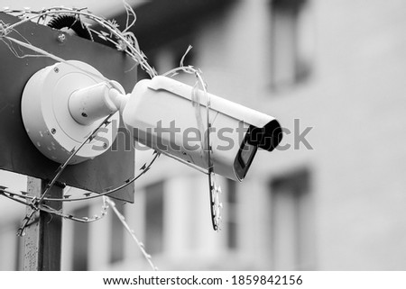 Black-and-white photo, close-up security camera. Criminal facial recognition software. Security concept. Security concept.